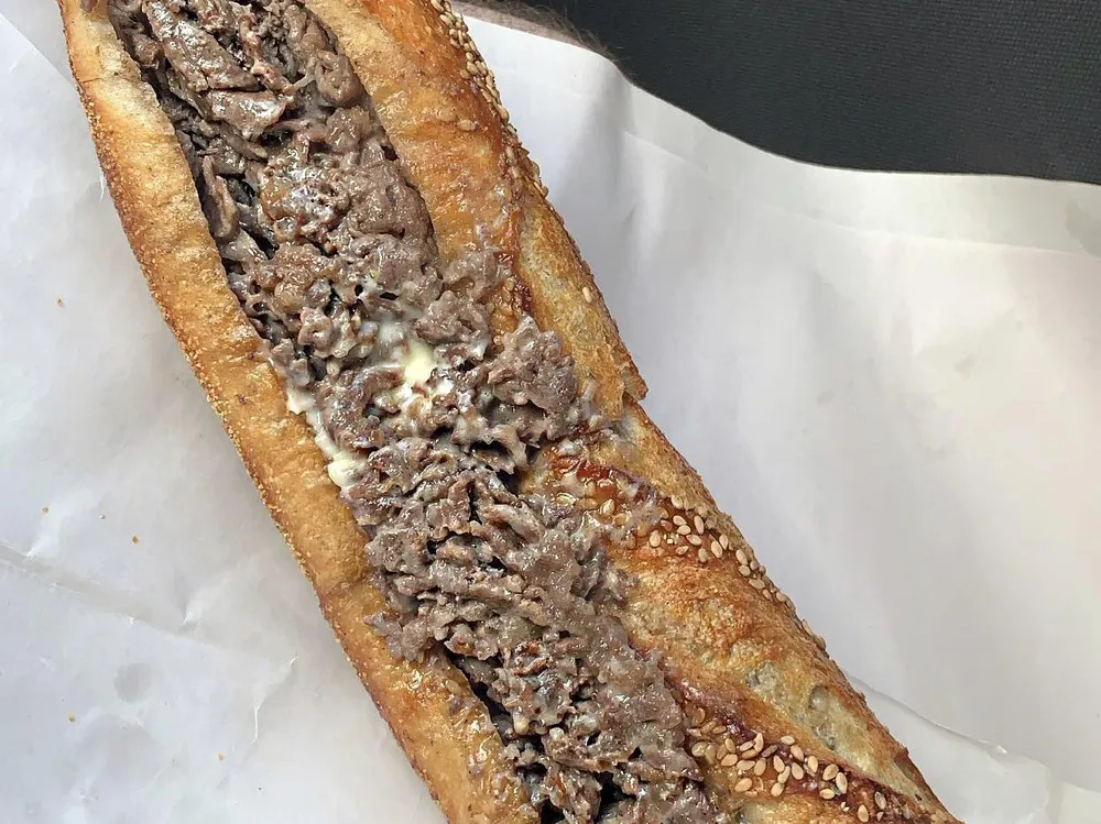 Angelo's cheesesteak on a seeded roll