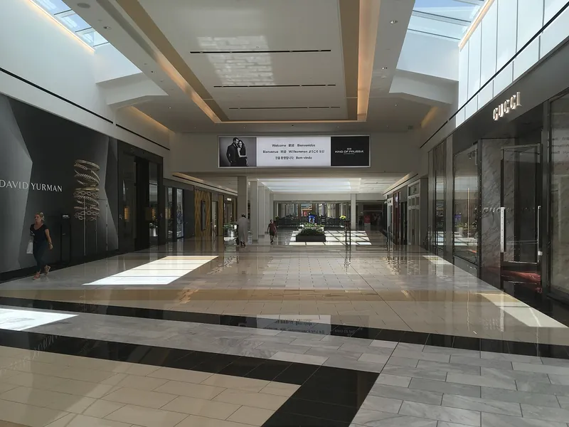 Skylit shopping corridor inside King of Prussia Mall