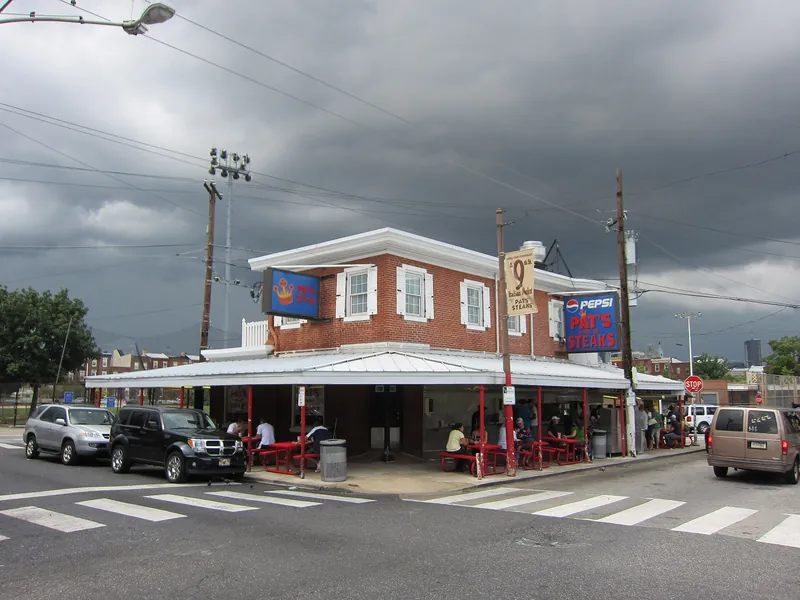 Pat's King of Steaks corner stand with its awning and outdoor tables